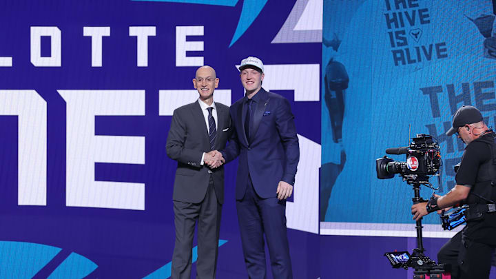 Jun 25, 2025; Brooklyn, NY, USA;  Kon Knueppel stands with NBA commissioner Adam Silver after being selected as the fourth pick by the Charlotte Hornets in the first round of the 2025 NBA Draft at Barclays Center. Mandatory Credit: Brad Penner-Imagn Images