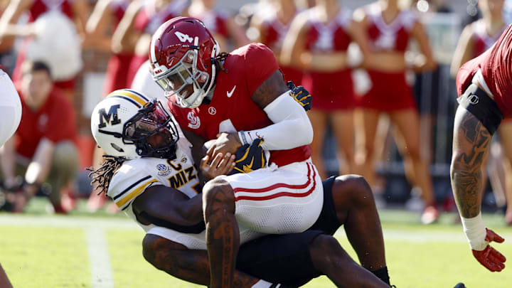Oct 26, 2024; Tuscaloosa, Alabama, USA; Alabama Crimson Tide quarterback Jalen Milroe (4) is sacked by Missouri Tigers defensive end Johnny Walker Jr. (15) during the first half at Bryant-Denny Stadium. Mandatory Credit: Butch Dill-Imagn Images Oct 26, 2024; Tuscaloosa, Alabama, USA; Alabama Crimson Tide quarterback Jalen Milroe (4) is sacked by Missouri Tigers defensive end Johnny Walker Jr. (15) during the first half at Bryant-Denny Stadium. Mandatory Credit: Butch Dill-Imagn Images