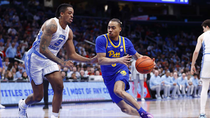 Mar 15, 2024; Washington, D.C., USA; Pittsburgh Panthers guard Ishmael Leggett (5) controls the ball as North Carolina Tar Heels forward Armando Bacot (5) defends during the second half at Capital One Arena. Mandatory Credit: Amber Searls-Imagn Images