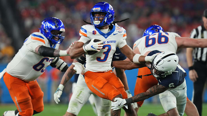 Dec 31, 2024; Glendale, AZ, US; Penn State Nittany Lions safety Zakee Wheatley (6) tackles Boise State Broncos receiver Latrell Caples (3) during their Vrbo Fiesta Bowl matchup at State Farm Stadium.