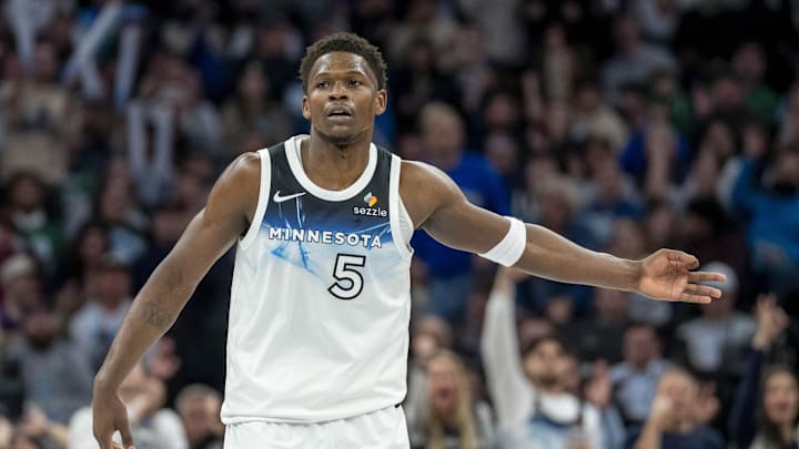 Jan 2, 2025; Minneapolis, Minnesota, USA; Minnesota Timberwolves guard Anthony Edwards (5) celebrates after making a three point shot against the Boston Celtics in the second half at Target Center. Mandatory Credit: Jesse Johnson-Imagn Images