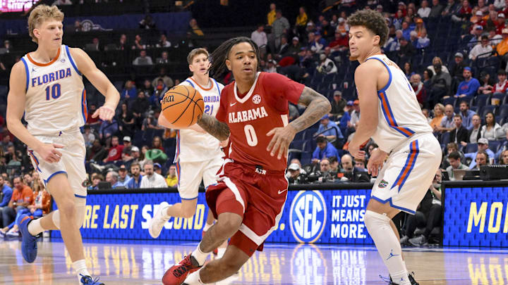 Mar 15, 2025; Nashville, TN, USA;  Alabama Crimson Tide guard Labaron Philon (0) drives to the basket against the Florida Gators during the second half at Bridgestone Arena