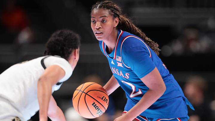 Kansas Jayhawks guard S'mya Nichols (12) looks for a play against Colorado Buffaloes during the second round game of the Big 12 Tournament inside T-Mobile Center in Kansas City, Missouri on Thursday, March 5, 2026. Kansas Jayhawks guard S'mya Nichols (12) looks for a play against Colorado Buffaloes during the second round game of the Big 12 Tournament inside T-Mobile Center in Kansas City, Missouri on Thursday, March 5, 2026.