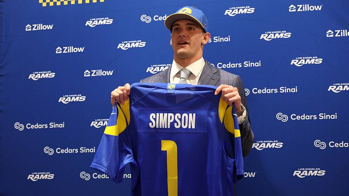 Apr 24, 2026; Inglewood, CA, USA; Los Angeles Rams first-round draft pick Ty Simpson poses with his jersey during a press conference at Code Next at Hollywood Park. Mandatory Credit: Kiyoshi Mio-Imagn Images Apr 24, 2026; Inglewood, CA, USA; Los Angeles Rams first-round draft pick Ty Simpson poses with his jersey during a press conference at Code Next at Hollywood Park. Mandatory Credit: Kiyoshi Mio-Imagn Images