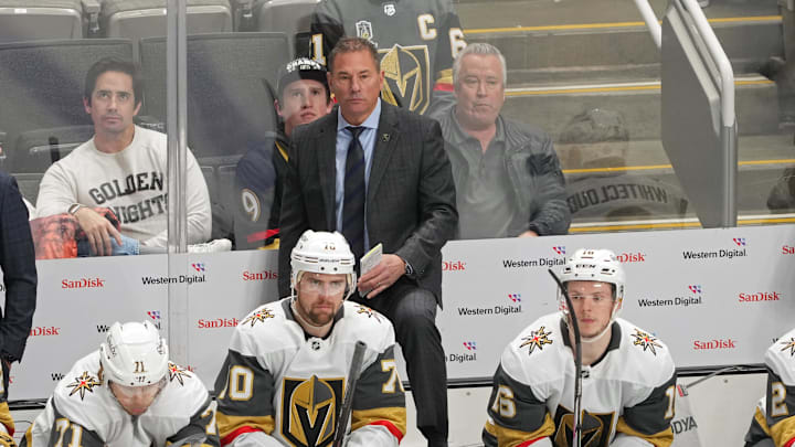 Jan 7, 2025; San Jose, California, USA; Vegas Golden Knights head coach Bruce Cassidy (center back) stands behind the bench during the third period against the San Jose Sharks at SAP Center at San Jose. Mandatory Credit: Darren Yamashita-Imagn Images