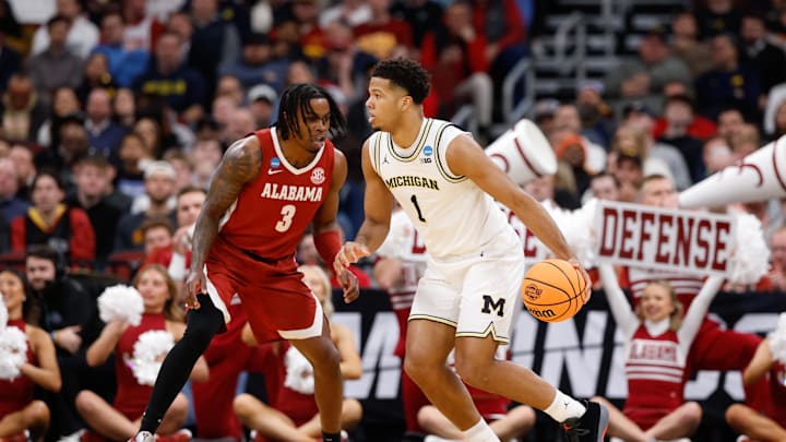 Mar 27, 2026; Chicago, IL, USA; Michigan Wolverines guard Trey McKenney (1) dribbles against Alabama Crimson Tide guard Latrell Wrightsell Jr. (3) in the first half during a Sweet Sixteen game of the Midwest Regional of the men's 2026 NCAA Tournament at United Center. Mandatory Credit: Kamil Krzaczynski-Imagn Images Mar 27, 2026; Chicago, IL, USA; Michigan Wolverines guard Trey McKenney (1) dribbles against Alabama Crimson Tide guard Latrell Wrightsell Jr. (3) in the first half during a Sweet Sixteen game of the Midwest Regional of the men's 2026 NCAA Tournament at United Center. Mandatory Credit: Kamil Krzaczynski-Imagn Images
