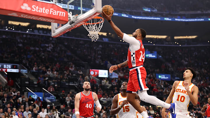 Jan 4, 2025; Inglewood, California, USA; Los Angeles Clippers guard Norman Powell (24) drives to the basket between Atlanta Hawks center Clint Capela (15) and forward Zaccharie Risacher (10) during the first half at Intuit Dome. Mandatory Credit: Kiyoshi Mio-Imagn Images Jan 4, 2025; Inglewood, California, USA; Los Angeles Clippers guard Norman Powell (24) drives to the basket between Atlanta Hawks center Clint Capela (15) and forward Zaccharie Risacher (10) during the first half at Intuit Dome. Mandatory Credit: Kiyoshi Mio-Imagn Images