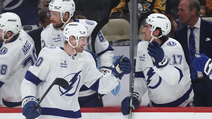 Jan 13, 2026; Pittsburgh, Pennsylvania, USA;  Tampa Bay Lightning defenseman J.J. Moser (90) celebrates his goal with the bench against the Pittsburgh Penguins during the third period at PPG Paints Arena. Mandatory Credit: Charles LeClaire-Imagn Images