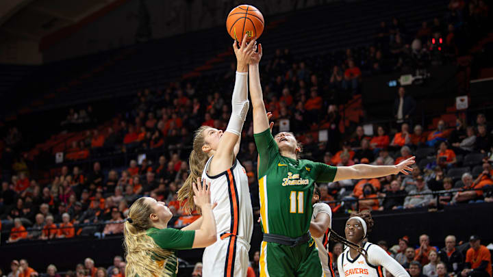 Oregon State's Kelsey Rees (53) and San Francisco's Angeliki Ziaka (11) jump for the rebound during an NCAA basketball game at Gill Coliseum on Thursday, Jan. 9, 2025, in Corvallis, Ore.
