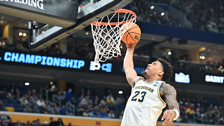 Mar 21, 2026; Buffalo, NY, USA; Michigan Wolverines forward Yaxel Lendeborg (23) dunks the ball in the second half against the Saint Louis Billikens during a second-round game of the men's 2026 NCAA Tournament Mar 21, 2026; Buffalo, NY, USA; Michigan Wolverines forward Yaxel Lendeborg (23) dunks the ball in the second half against the Saint Louis Billikens during a second-round game of the men's 2026 NCAA Tournament