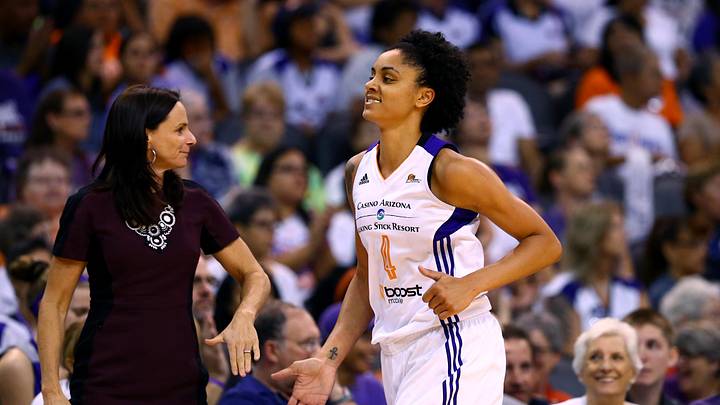 Sep 7, 2014; Phoenix, AZ, USA; Phoenix Mercury forward Candice Dupree (4) with head coach Sandy Brondello against the Chicago Sky during game one of the WNBA Finals at US Airways Center. The Mercury defeated the Sky 83-62. Mandatory Credit: Mark J. Rebilas-Imagn Images
