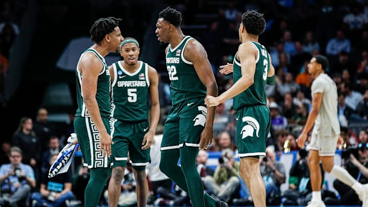 Michigan State guard A.J. Hoggard (11), guard Tre Holloman (5) and center Mady Sissoko (22) celebrate a play against Mississippi State during the second half of NCAA tournament West Region first round at Spectrum Center in Charlotte, N.C. on Thursday, March 21, 2024. Michigan State guard A.J. Hoggard (11), guard Tre Holloman (5) and center Mady Sissoko (22) celebrate a play against Mississippi State during the second half of NCAA tournament West Region first round at Spectrum Center in Charlotte, N.C. on Thursday, March 21, 2024.
