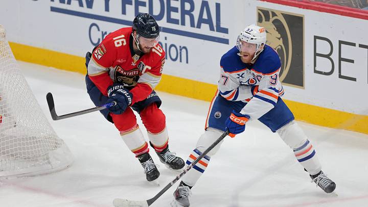 Jun 17, 2025; Sunrise, Florida, USA; Edmonton Oilers center Connor McDavid (97) passes the puck away from Florida Panthers center Aleksander Barkov (16) during the third period in game six of the 2025 Stanley Cup Final at Amerant Bank Arena. Mandatory Credit: Sam Navarro-Imagn Images Jun 17, 2025; Sunrise, Florida, USA; Edmonton Oilers center Connor McDavid (97) passes the puck away from Florida Panthers center Aleksander Barkov (16) during the third period in game six of the 2025 Stanley Cup Final at Amerant Bank Arena. Mandatory Credit: Sam Navarro-Imagn Images