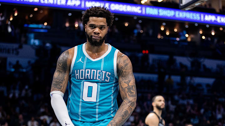 Mar 8, 2025; Charlotte, North Carolina, USA; Charlotte Hornets forward Miles Bridges (0) celebrates after scoring against the Brooklyn Nets during the fourth quarter at Spectrum Center. Mandatory Credit: Scott Kinser-Imagn Images