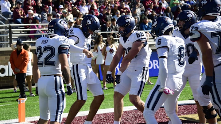 Oct 18, 2025; Chestnut Hill, Massachusetts, USA;  UConn Huskies quarterback Joe Fagnano (2) reacts with tight end Alex Honig (86) after scoring a touchdown during the first half against the Boston College Eagles at Alumni Stadium. Mandatory Credit: Bob DeChiara-Imagn Images