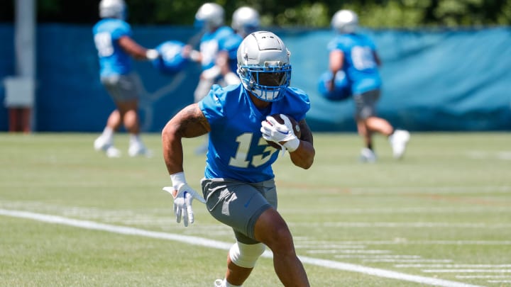 Detroit Lions running back Craig Reynolds (13) practices during OTAs at Detroit Lions headquarters and training facility in Allen Park on Thursday, May 30, 2024.