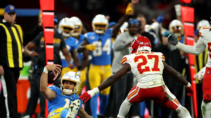 Los Angeles Chargers quarterback Justin Herbert (10) picks up a first down against Kansas City Chiefs