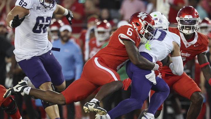 Nov 22, 2025; Houston, Texas, USA; Houston Cougars defensive back Jordan Allen (6) sacks TCU Horned Frogs quarterback Josh Hoover (10) during the third quarter at TDECU Stadium. Mandatory Credit: Troy Taormina-Imagn Images