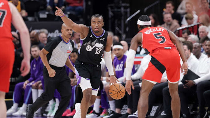 Mar 14, 2025; Salt Lake City, Utah, USA;  Utah Jazz guard Isaiah Collier (13) directs his team against the Toronto Raptors during the first quarter at Delta Center. Mandatory Credit: Chris Nicoll-Imagn Images