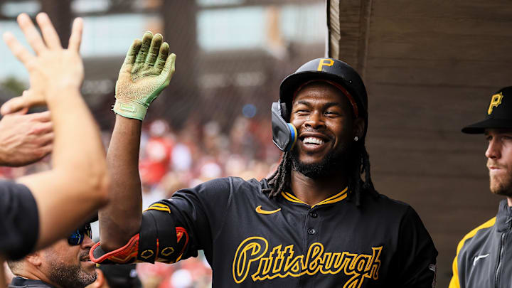 Sep 22, 2024; Cincinnati, Ohio, USA; Pittsburgh Pirates outfielder Oneil Cruz (15) high fives teammates after hitting a solo home run in the first inning against the Cincinnati at Great American Ball Park. Mandatory Credit: Katie Stratman-Imagn Images