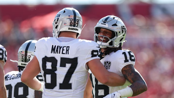 Dec 8, 2024; Tampa, Florida, USA; Las Vegas Raiders wide receiver Jakobi Meyers (16) and tight end Michael Mayer (87) celebrate after a play against the Tampa Bay Buccaneers in the first quarter at Raymond James Stadium. Mandatory Credit: Nathan Ray Seebeck-Imagn Images Dec 8, 2024; Tampa, Florida, USA; Las Vegas Raiders wide receiver Jakobi Meyers (16) and tight end Michael Mayer (87) celebrate after a play against the Tampa Bay Buccaneers in the first quarter at Raymond James Stadium. Mandatory Credit: Nathan Ray Seebeck-Imagn Images