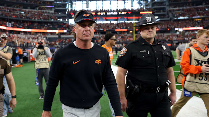 Oklahoma State football head coach Mike Gundy walks of the field following the Big 12 Football Championship game between the Oklahoma State University Cowboys and the Texas Longhorns at the AT&T Stadium in Arlington, Texas, Saturday, Dec. 2, 2023. Oklahoma State football head coach Mike Gundy walks of the field following the Big 12 Football Championship game between the Oklahoma State University Cowboys and the Texas Longhorns at the AT&T Stadium in Arlington, Texas, Saturday, Dec. 2, 2023.