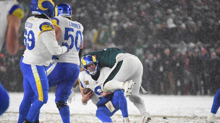 Jan 19, 2025; Philadelphia, Pennsylvania, USA; Los Angeles Rams quarterback Matthew Stafford (9) is sacked by Philadelphia Eagles defensive tackle Jalen Carter (98) during the fourth quarter in a 2025 NFC divisional round game at Lincoln Financial Field. Mandatory Credit: Eric Hartline-Imagn Images
