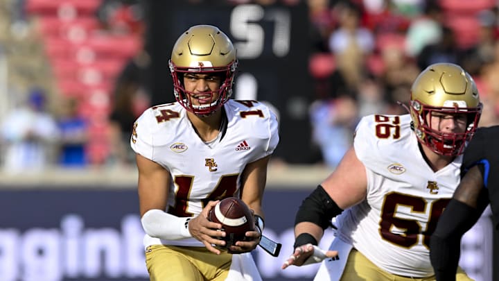 Nov 16, 2024; Dallas, Texas, USA; Boston College Eagles quarterback Grayson James (14) and offensive lineman Drew Kendall (66) in action during the game between the SMU Mustangs and the Boston College Eagles at Gerald J. Ford Stadium. Mandatory Credit: Jerome Miron-Imagn Images