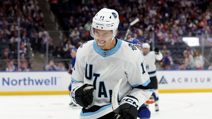 Oct 10, 2024; Elmont, New York, USA; Utah Hockey Club right wing Dylan Guenther (11) celebrates his goal against the New York Islanders during the third period at UBS Arena. Mandatory Credit: Brad Penner-Imagn Images