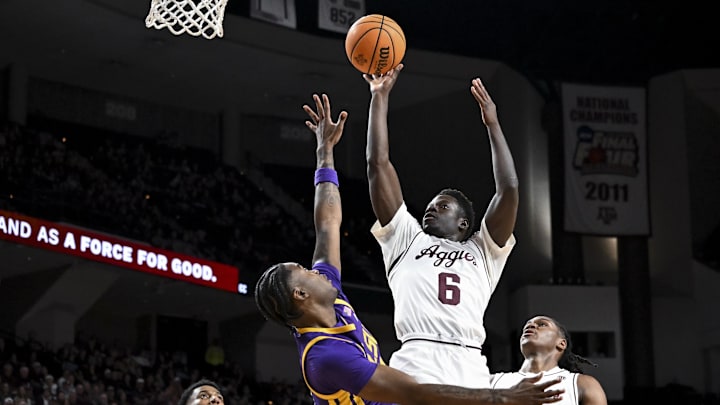 Jan 3, 2026; College Station, Texas, USA;  Texas A&M Aggies guard Ali Dibba (6) shoots during the first half as Louisiana State Tigers guard Rashad King (4) defends at Reed Arena. Mandatory Credit: Maria Lysaker-Imagn Images 