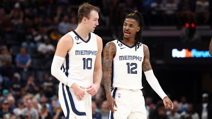 Memphis Grizzlies guard Luke Kennard (10) and Memphis Grizzlies guard Ja Morant (12) talk during the second half against the Portland Trail Blazers at FedExForum. Mandatory Credit: Petre Thomas-Imagn Images