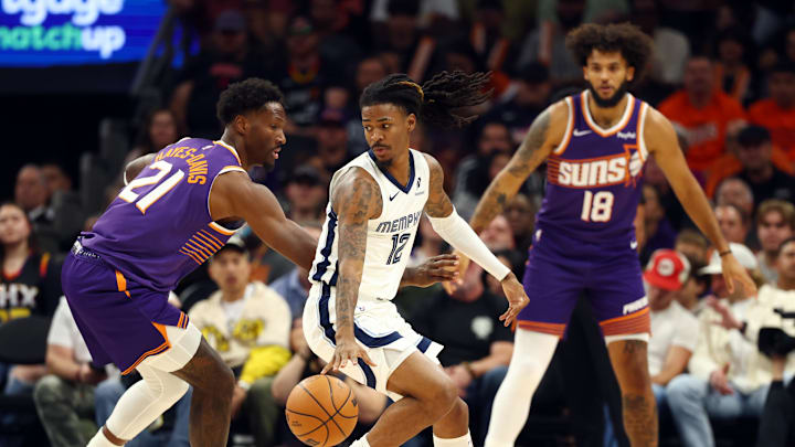 Oct 29, 2025; Phoenix, Arizona, USA; Memphis Grizzlies guard Ja Morant (12) against Phoenix Suns forward Nigel Hayes-Davis (21) during the first half at the Mortgage Matchup Center. Mandatory Credit: Mark J. Rebilas-Imagn Images Oct 29, 2025; Phoenix, Arizona, USA; Memphis Grizzlies guard Ja Morant (12) against Phoenix Suns forward Nigel Hayes-Davis (21) during the first half at the Mortgage Matchup Center. Mandatory Credit: Mark J. Rebilas-Imagn Images