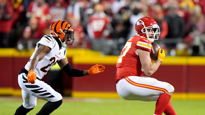 Kansas City Chiefs tight end Travis Kelce (87) catches a pass as Cincinnati Bengals cornerback Chidobe Awuzie (22) defends in the fourth quarter on Dec. 31, 2023, at GEHA Field at Arrowhead Stadium in Kansas City.