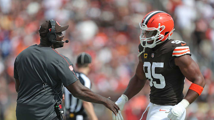 Cleveland Browns defensive line coach Jacques Cesaire, left, celebrates with defensive end Myles Garrett (95) during the first half of an NFL football game at Huntington Bank Field, Sunday, Sept. 22, 2024, in Cleveland, Ohio.