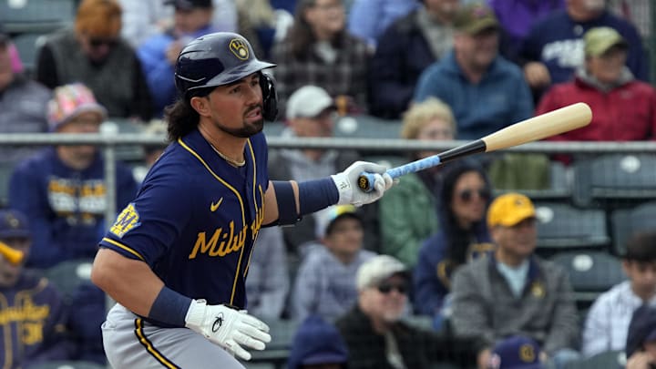 Mar 1, 2023; Tempe, Arizona, USA; Milwaukee Brewers catcher Payton Henry (50) hits an RBI single against the Los Angeles Angels in the second inning at Tempe Diablo Stadium. Mandatory Credit: Rick Scuteri-USA TODAY Sports