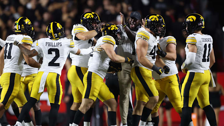Sep 19, 2025; Piscataway, New Jersey, USA; Iowa Hawkeyes linebacker Jaxon Rexroth (12) celebrates with teammates after intercepting a pass during the second half against the Rutgers Scarlet Knights at SHI Stadium. Mandatory Credit: Vincent Carchietta-Imagn Images