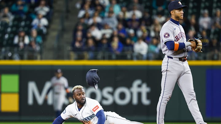 Seattle Mariners left fielder Randy Arozarena (56, left) looks back after stealing second base against Houston Astros shortstop Jeremy Peña (3) during the first inning at T-Mobile Park on April 7. Seattle Mariners left fielder Randy Arozarena (56, left) looks back after stealing second base against Houston Astros shortstop Jeremy Peña (3) during the first inning at T-Mobile Park on April 7.