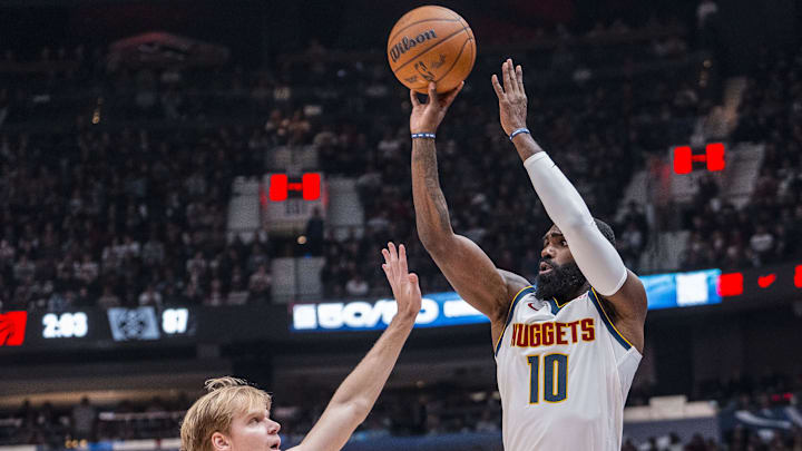 Oct 6, 2025; Vancouver, British Columbia, CAN; Denver Nuggets guard Tim Hardaway Jr (10) shoots over Toronto Raptors forward Gradey Dick (1) in the second half at Rogers Arena. Mandatory Credit: Bob Frid-Imagn Images