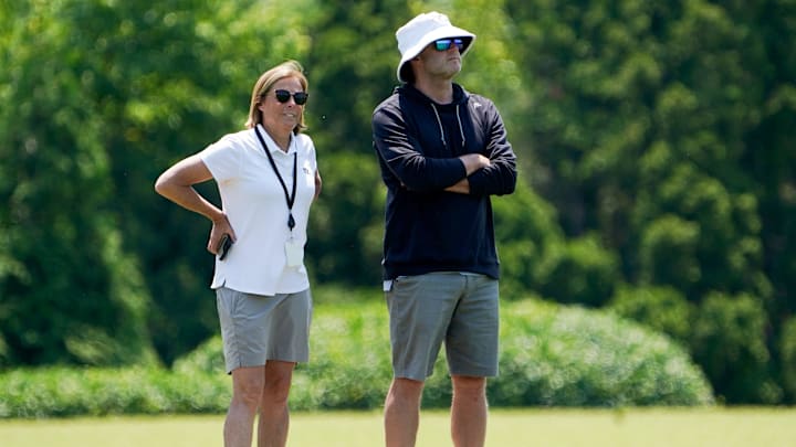 Katie Blackburn, left, and Duke Tobin, right, watch the Cincinnati Bengals practice, Wednesday, June 11, 2025, at Kettering Health Practice Fields in Downtown Cincinnati. Katie Blackburn, left, and Duke Tobin, right, watch the Cincinnati Bengals practice, Wednesday, June 11, 2025, at Kettering Health Practice Fields in Downtown Cincinnati.