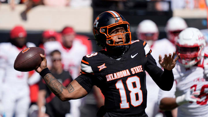 Oklahoma State Cowboys quarterback Sam Jackson V (18) throws a pass during a college football game between the Oklahoma State Cowboys (OSU) and the Houston Cougars at Boone Pickens Stadium in Stillwater, Okla., Saturday, Oct. 11, 2025. Houston won 39-17. Oklahoma State Cowboys quarterback Sam Jackson V (18) throws a pass during a college football game between the Oklahoma State Cowboys (OSU) and the Houston Cougars at Boone Pickens Stadium in Stillwater, Okla., Saturday, Oct. 11, 2025. Houston won 39-17.