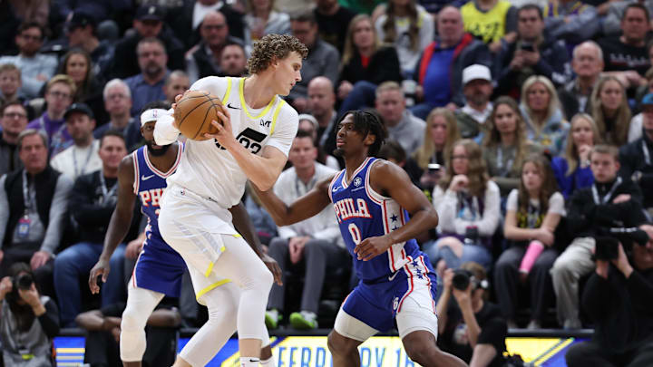 Feb 1, 2024; Salt Lake City, Utah, USA; Utah Jazz forward Lauri Markkanen (23) looks to drive against Philadelphia 76ers guard Tyrese Maxey (0) during the first quarter at Delta Center. Mandatory Credit: Rob Gray-Imagn Images