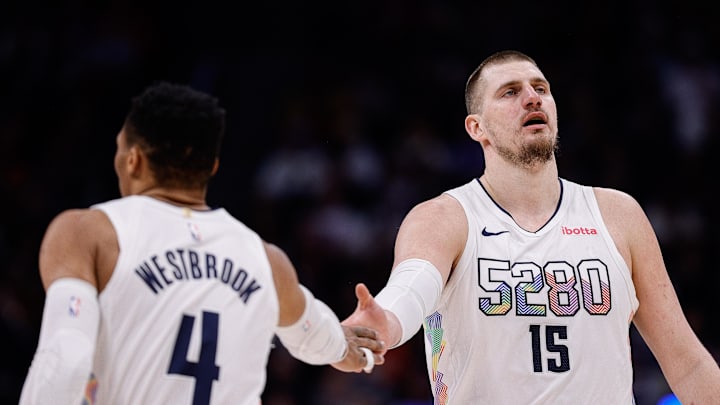 Jan 21, 2025; Denver, Colorado, USA; Denver Nuggets center Nikola Jokic (15) and guard Russell Westbrook (4) in the third quarter against the Philadelphia 76ers at Ball Arena. Mandatory Credit: Isaiah J. Downing-Imagn Images