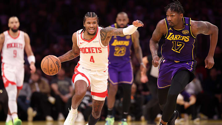 Houston Rockets guard Jalen Green (4) dribbles the ball against Los Angeles Lakers forward Dorian Finney-Smith (17).