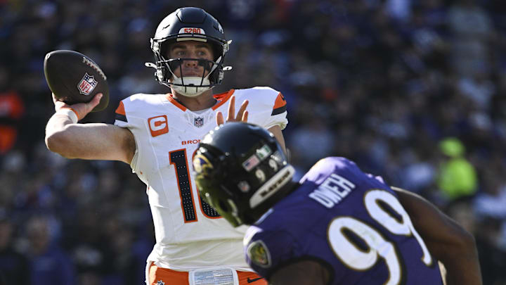 Nov 3, 2024; Baltimore, Maryland, USA;  Denver Broncos quarterback Bo Nix (10) throws as Baltimore Ravens linebacker Odafe Oweh (99) defends xduring the first half at M&T Bank Stadium. 