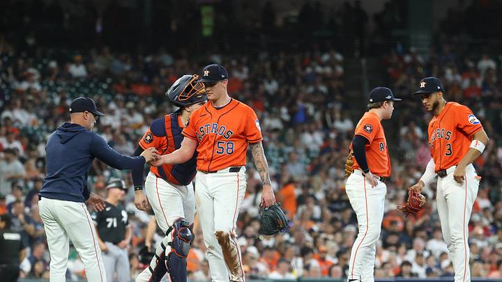 Sep 30, 2026; Houston, Texas, USA;  Houston Astros manager Joe Espada (21) takes the ball from pitcher Hunter Brown (58) in the first inning against the Chicago White Sox during game two of the Wildcard round for the 2026 MLB Playoffs at Daikin Park.  Mandatory Credit: Troy Taormina-Imagn Images