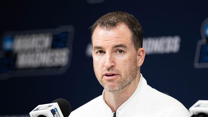 Mar 21, 2024; Indianapolis, IN, USA; Utah State Aggies head coach Danny Sprinkle talks to the media during the practice day at Gainbridge FieldHouse. Mandatory Credit: Trevor Ruszkowski-Imagn Images