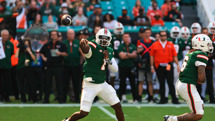 Nov 23, 2024; Miami Gardens, Florida, USA; Miami Hurricanes quarterback Cam Ward (1) throws the football against the Wake Forest Demon Deacons during the first quarter at Hard Rock Stadium. Mandatory Credit: Sam Navarro-Imagn Images