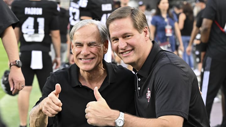 Oct 26, 2024; College Station, Texas, USA; Texas Governer Greg Abbott, left, and Texas A&M Athletic Director Trev Alberts pose for pictures prior to the game against the LSU Tigers. The Aggies defeated the Tigers 38-23; at Kyle Field. Mandatory Credit: Maria Lysaker-Imagn Images. Oct 26, 2024; College Station, Texas, USA; Texas Governer Greg Abbott, left, and Texas A&M Athletic Director Trev Alberts pose for pictures prior to the game against the LSU Tigers. The Aggies defeated the Tigers 38-23; at Kyle Field. Mandatory Credit: Maria Lysaker-Imagn Images.