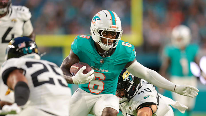 Miami Dolphins wide receiver Malik Washington (6) breaks a tackle against Jacksonville Jaguars linebacker Chad Muma (48) before scoring a touchdown during the second quarter at Hard Rock Stadium. Miami Dolphins wide receiver Malik Washington (6) breaks a tackle against Jacksonville Jaguars linebacker Chad Muma (48) before scoring a touchdown during the second quarter at Hard Rock Stadium.