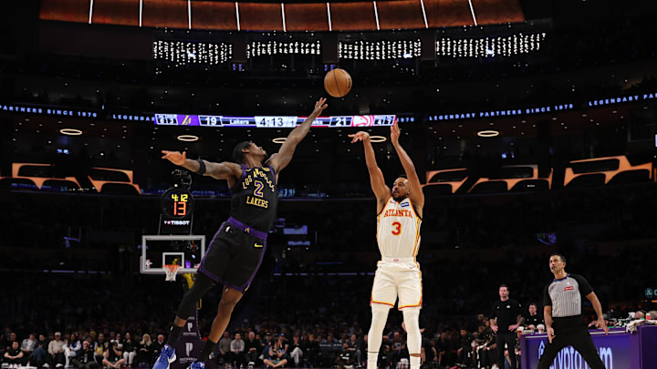 Jan 13, 2026; Los Angeles, California, USA;  Atlanta Hawks guard CJ McCollum (3) shoots the ball over Los Angeles Lakers forward Jarred Vanderbilt (2) during the first quarter at Crypto.com Arena. Mandatory Credit: Kiyoshi Mio-Imagn Images